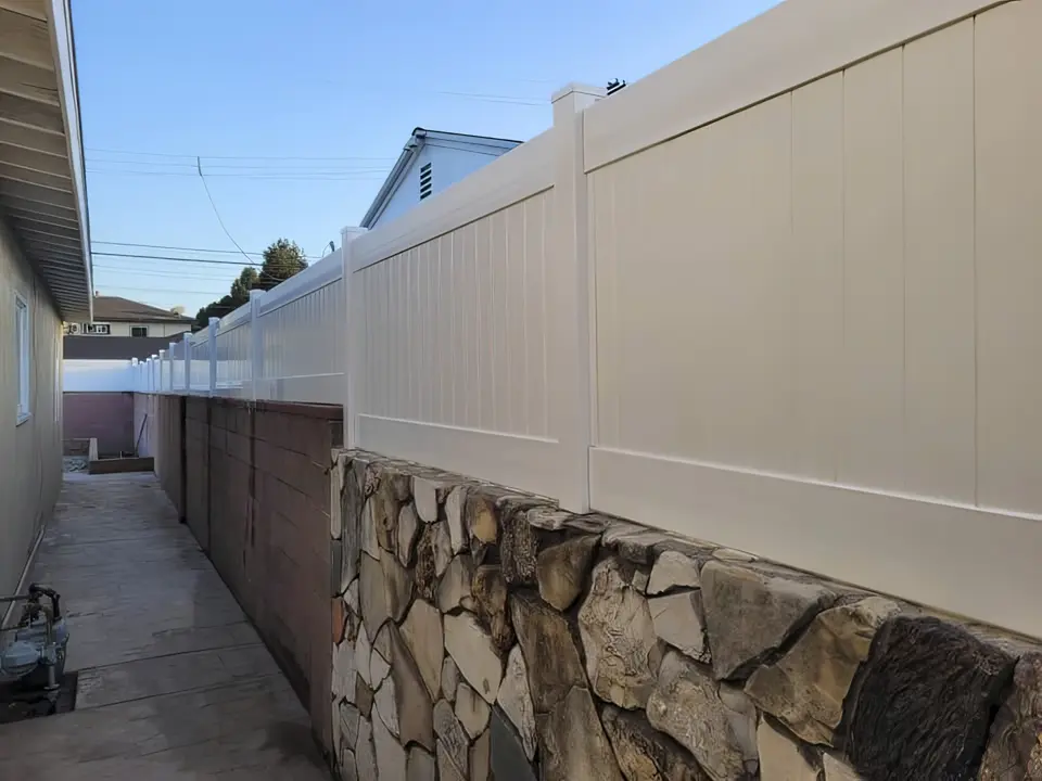Privacy wall topper adding height to stucco wall